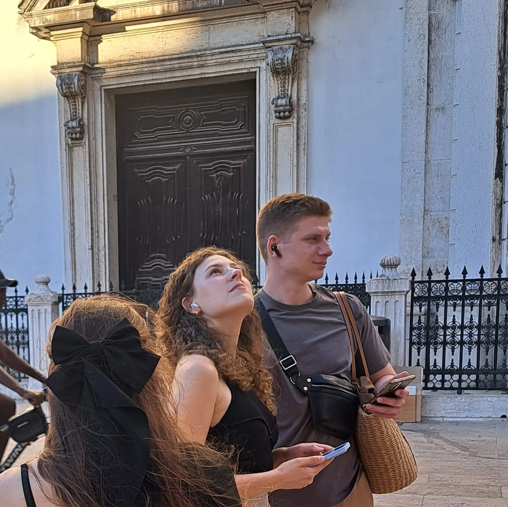 A couple resting on Lisbon's tiled steps